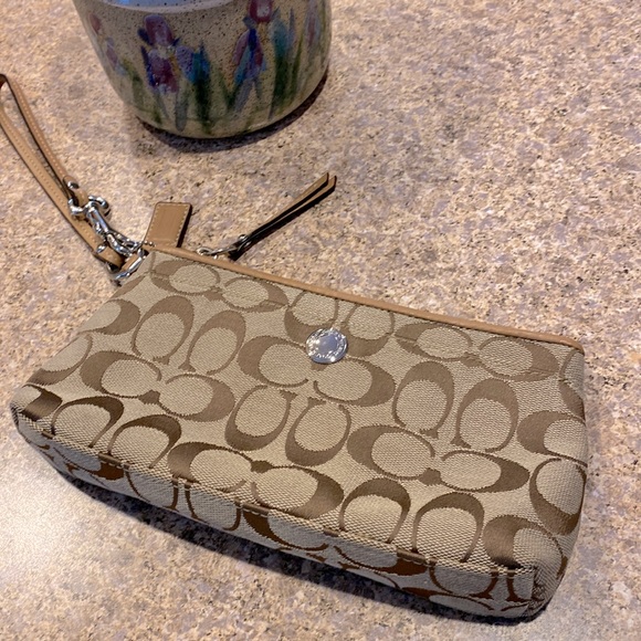 Coach Handbags - Coach Tan / Brown Wristlet Signature C Canvas With Leather Trim